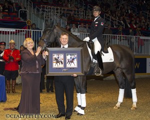 Deborah Miculinic Kinzinger was named 2013 Dressage Canada Owner of the Year. Deborah accepts the award alongside Vel Miculinic and David Marcus aboard Chrevi's Capital. Photo by Cealy Tetley.