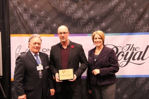 OEF president Allan Ehrlick and BFL vice-president and associate Sara Runnalls present Stefan Morel with the OEF Media of the Year award in the video category.