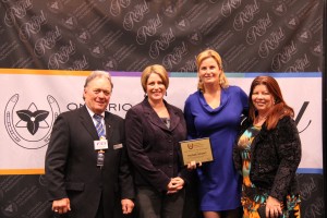 OEF president Allan Ehrlick and BFL vice-president Sara Runnalls present Horse Sport publisher Jennifer Anstey and director of sales Dianne Denby with the OEF Media of the Year Award. 