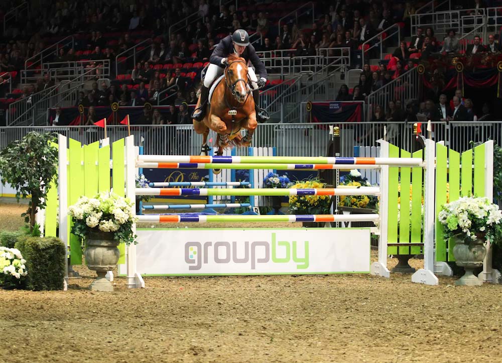 America’s McLain Ward and Rothchild charge over the GroupBy oxer to take the $100,000 Hickstead FEI World CupTM Grand Prix presented by GroupBy, Wednesday evening at the Royal Horse Show.