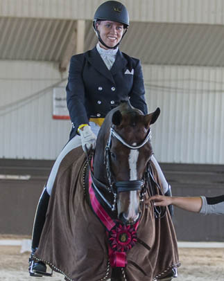 At the International Dressage Tournament CDI 3* Cedar Valley, held June 19-22, 2014 in Cedar Valley, ON, Canada's young dressage talent, Megan Lane, won both the Grand Prix and Grand Prix Special. Photo by Mary White, Lone Oak Equine Photography.