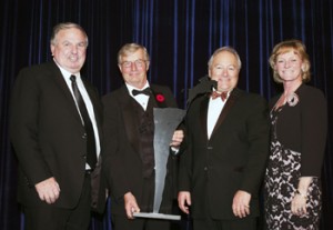 John Weir, Craig Collins and Bob Carey of Equestrian Management Group accept the Jump Canada Hall of Fame Award in the category of Builder (Organization) from Canadian Olympian Beth Underhill. Photo by Michelle C. Dunn.